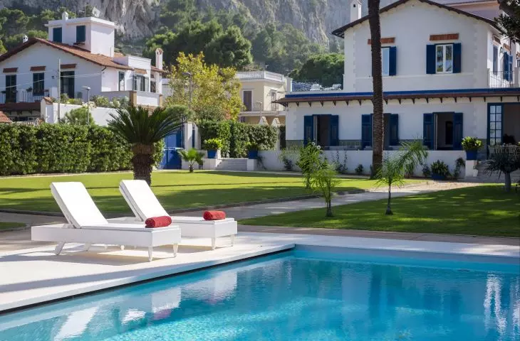 The infinity pool is surrounded by Mediterranean vegetation