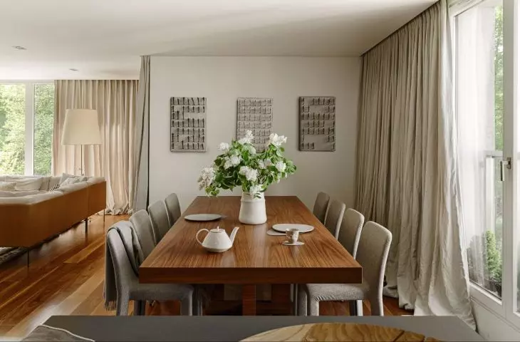 The walls of the dining room are decorated with three intriguing paintings