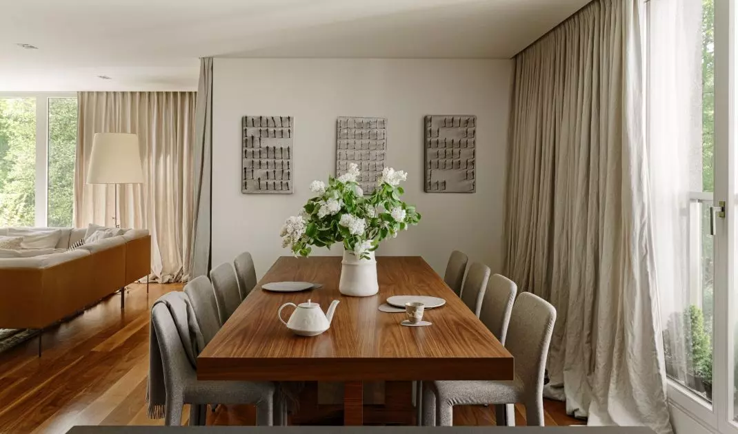 The walls of the dining room are decorated with three intriguing paintings