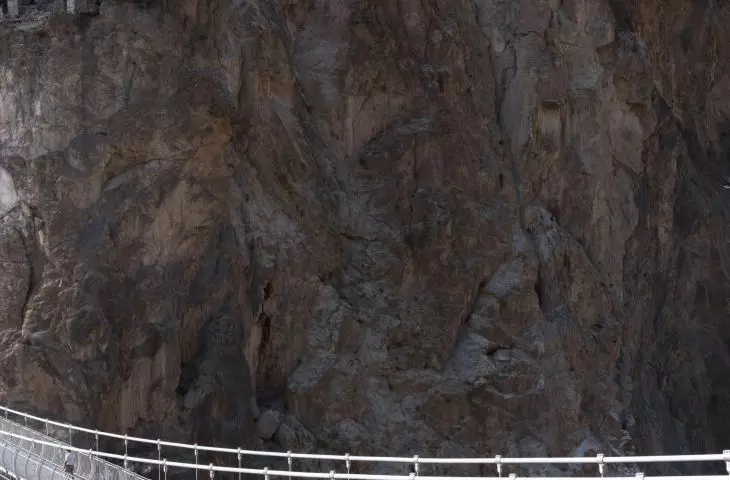 Viewing platform over the cliffs of the Grand Canyon of the Nujiang River - view n the bridge leading to the other end of the bank    
