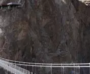 Viewing platform over the cliffs of the Grand Canyon of the Nujiang River - view n the bridge leading to the other end of the bank    