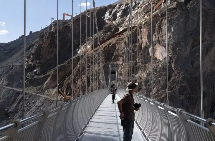 Viewing platform over the cliffs of the Grand Canyon of the Nujiang River - view of the bridge 