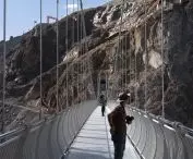 Viewing platform over the cliffs of the Grand Canyon of the Nujiang River - view of the bridge 