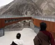 viewing platform over the cliffs of the Grand Canyon of the Nujiang River - steel in the shade of Tibetan red, refers to the local culture