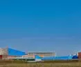 Modern architectural complex with blue and orange building walls