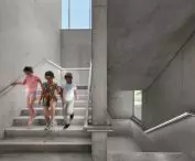 Children descending modern concrete stairs