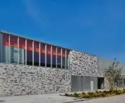 Modern building with patterned brick wall and large windows