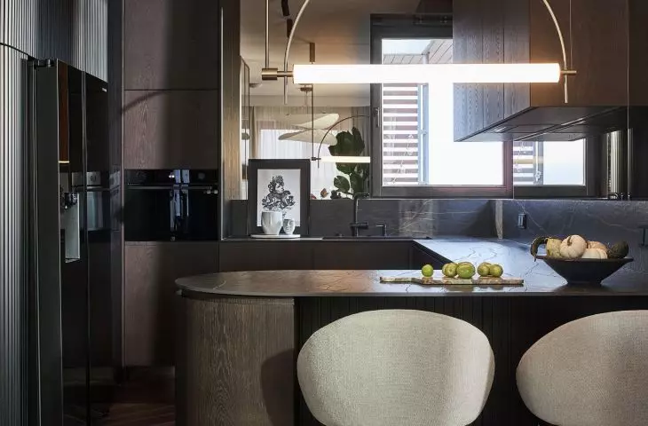 The focal point of the kitchen is an island with a bar