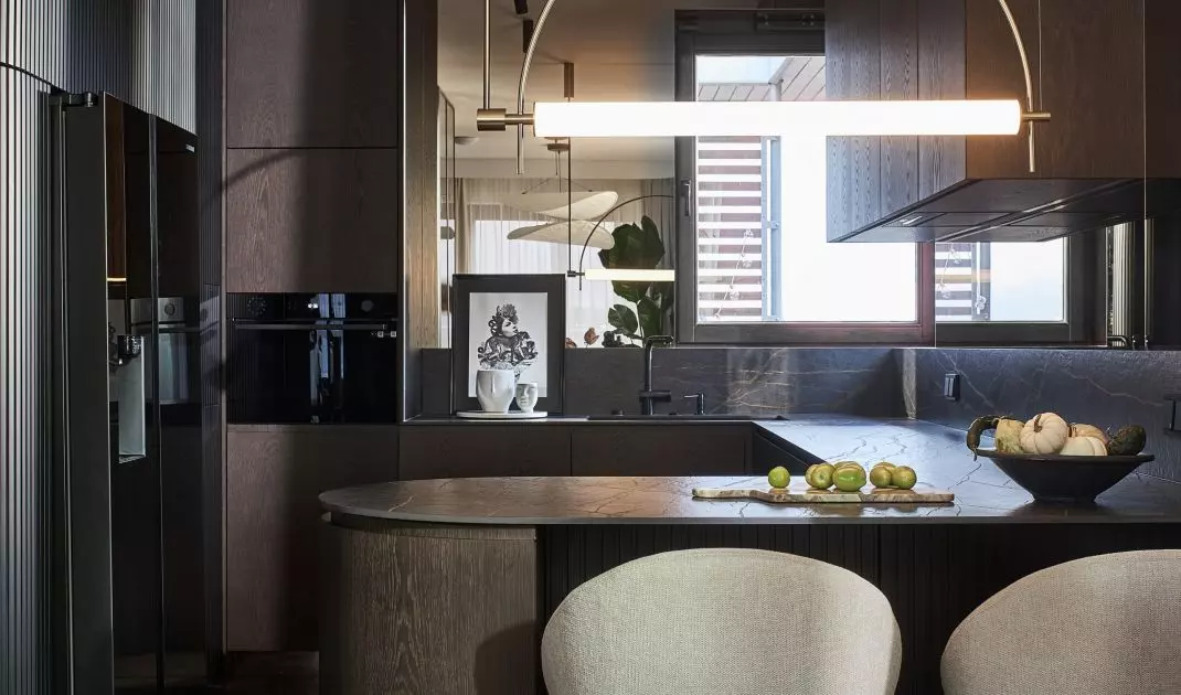 The focal point of the kitchen is an island with a bar