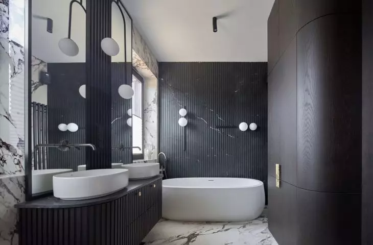 The large bathroom features a rounded bathtub