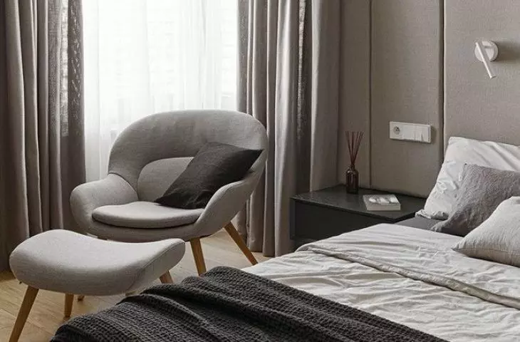 Upholstered panels cover almost the entire wall