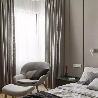 Upholstered panels cover almost the entire wall