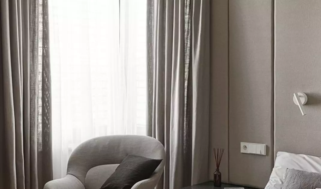Upholstered panels cover almost the entire wall