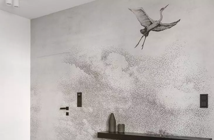 The wall opposite the bed was covered with wallpaper with a crane motif