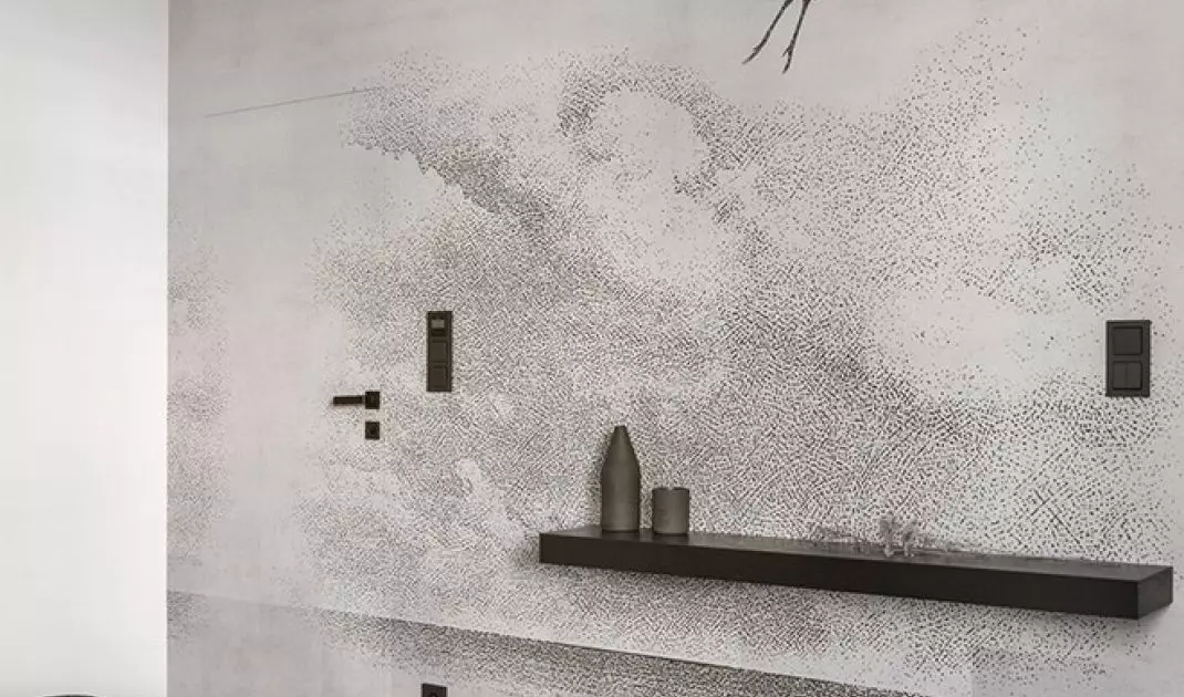 The wall opposite the bed was covered with wallpaper with a crane motif
