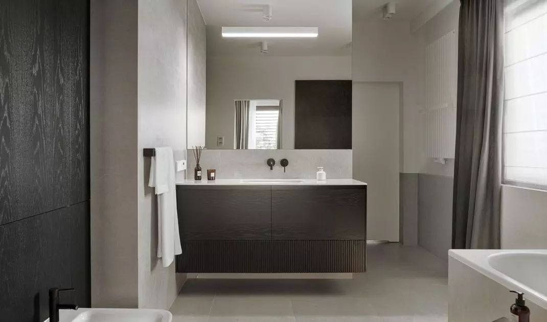 The bathroom can be accessed from both bedrooms