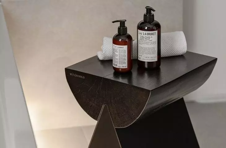 The stool was made from a raw tree trunk on sheet metal legs