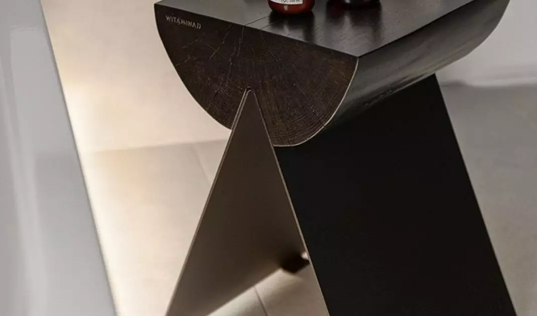 The stool was made from a raw tree trunk on sheet metal legs