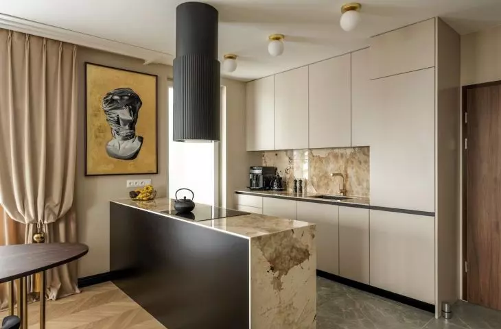Brazilian quartzite appears on the kitchen island and the area between the cabinets