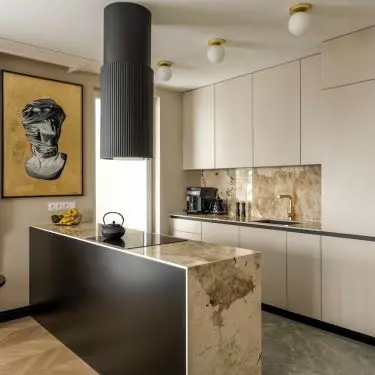 Brazilian quartzite appears on the kitchen island and the area between the cabinets