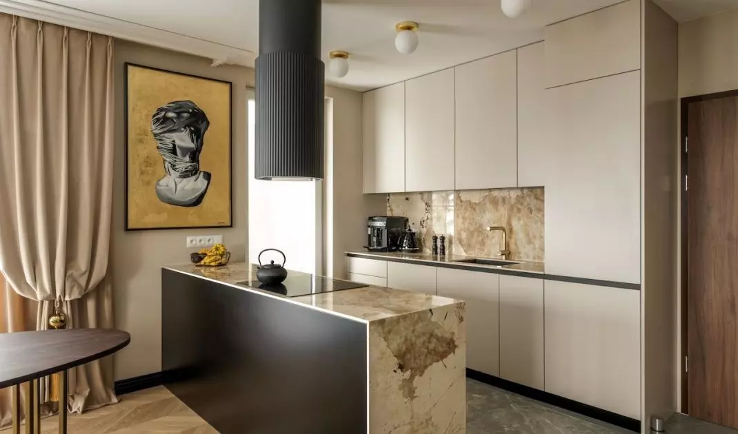 Brazilian quartzite appears on the kitchen island and the area between the cabinets