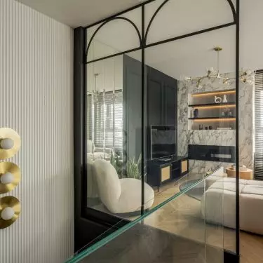 A glass balustrade with arches takes up an entire wall