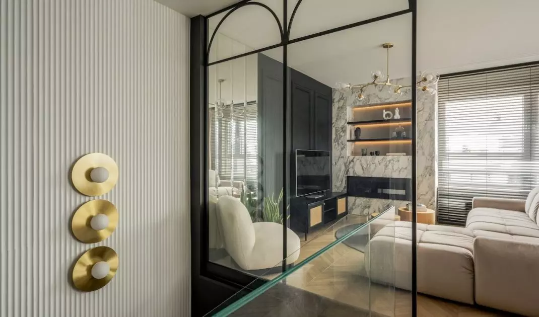 A glass balustrade with arches takes up an entire wall