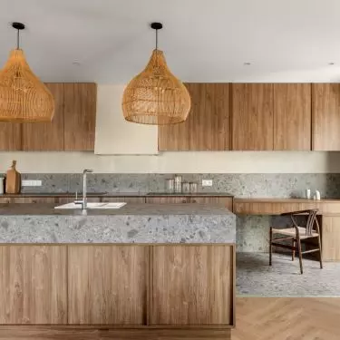 The architect delineated functional zones with finishing materials