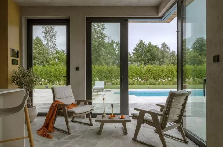 The corner of the house next to the pool has been glazed