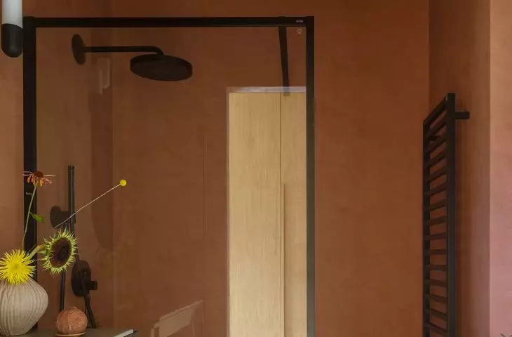 Stone flooring is also found in the shower area