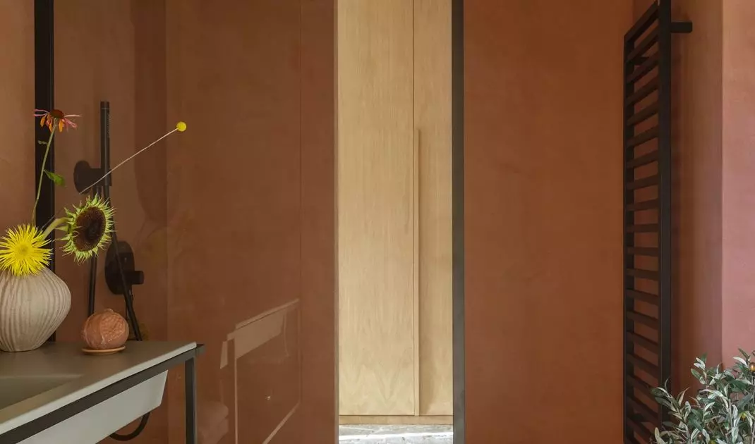Stone flooring is also found in the shower area