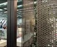 Perforated sheets and bent-drawn mesh in modern office buildings
