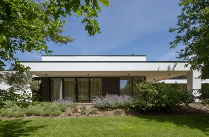 The residence is surrounded by greenery