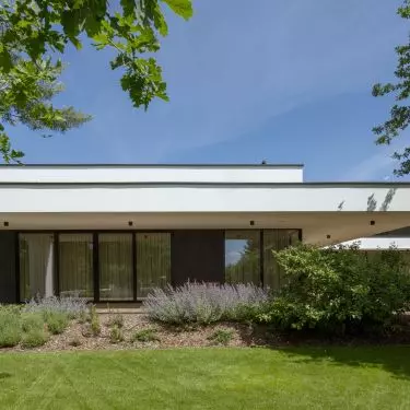 The residence is surrounded by greenery
