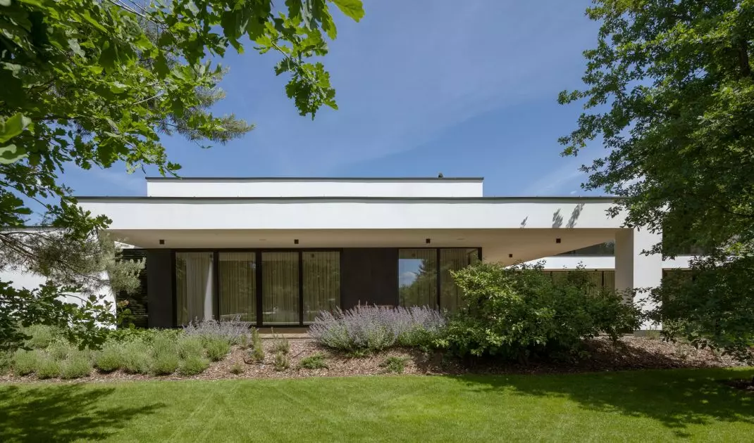 The residence is surrounded by greenery