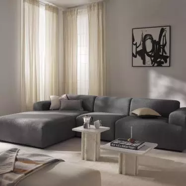 Softer forms of furnishings will balance the austere character of the interior
