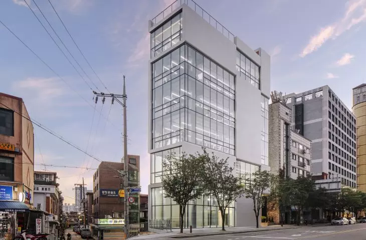 Urban Lining building in Gangdong district - the facades, which combine concrete slabs with glazing, are tailored for orientation relative to light and views