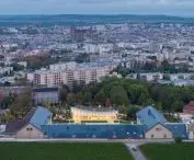 Nicolas Ruinart Pavilion in Reims, Champagne - bird's eye view of the pavilion and Maison Ruinart, with Reims Cathedral in the background