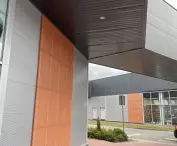 Perforated sheets and bent-drawn mesh in modern office buildings