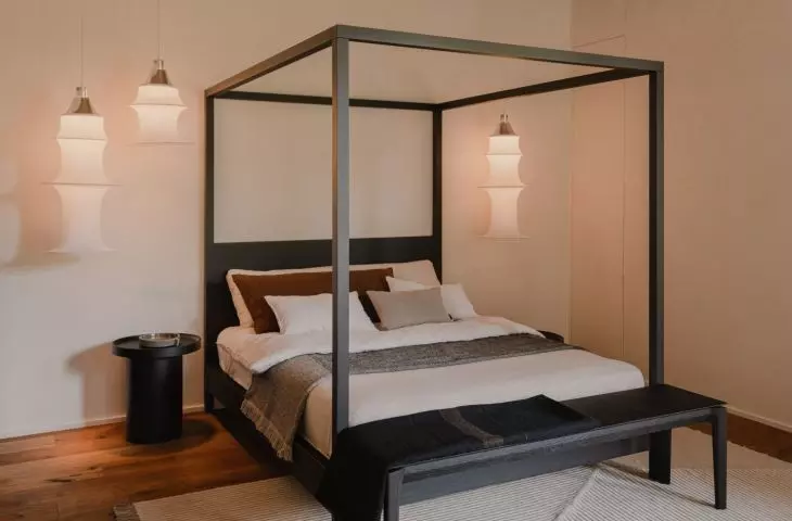 The master bedroom has a canopy bed