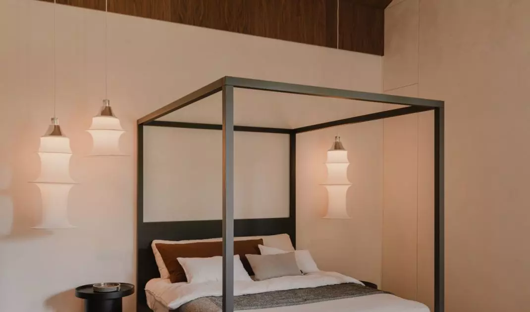 The master bedroom has a canopy bed