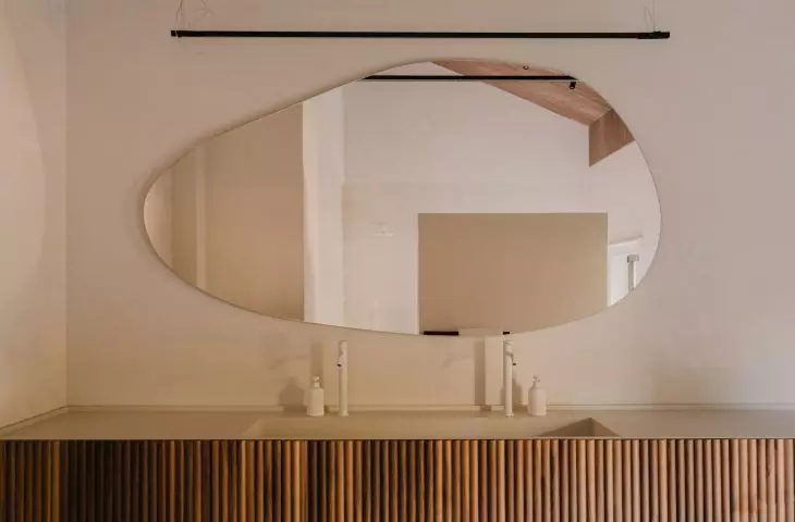Fluted bathroom cabinet fronts add variety to the arrangement