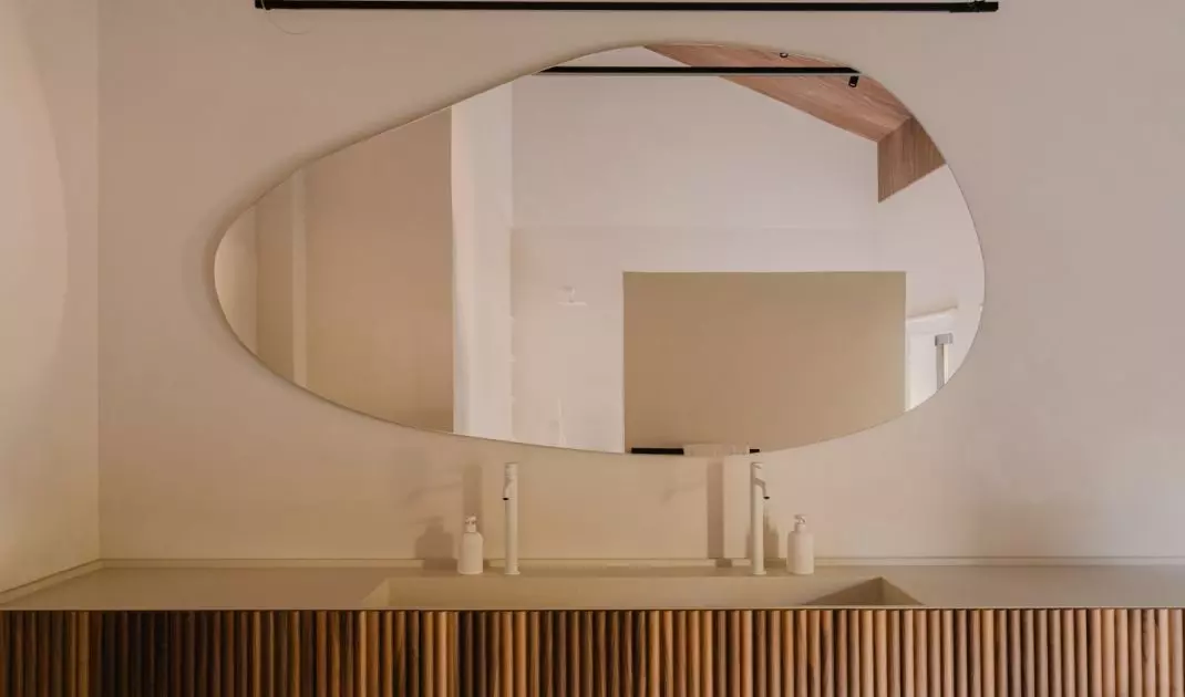 Fluted bathroom cabinet fronts add variety to the arrangement