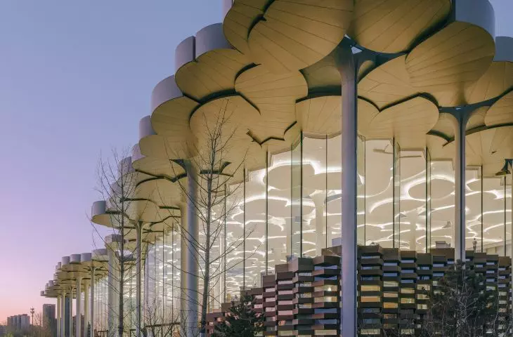 Library in Tongzhou, Beijing - an overhanging portion of the roof to the outside creates an arcade that reduces heat buildup in the building and glass walls