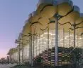 Library in Tongzhou, Beijing - an overhanging portion of the roof to the outside creates an arcade that reduces heat buildup in the building and glass walls