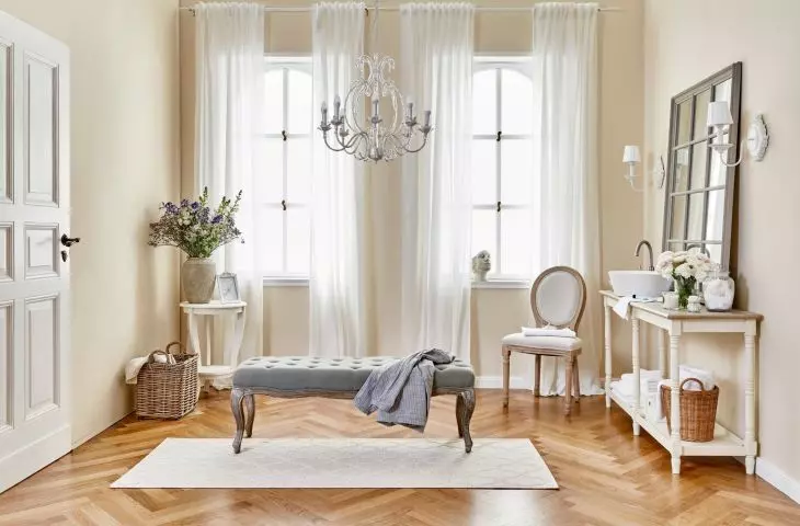 The ornate chandelier will fit perfectly into the aesthetics of shabby chic