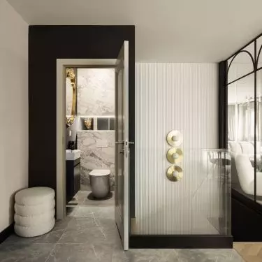 The toilet is located on the first floor, next to the living area