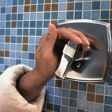 Opt for an open shower with a seat and handles for safety