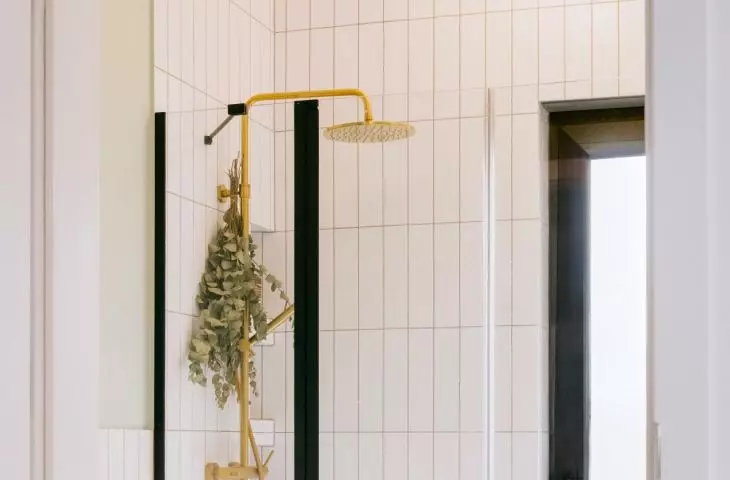 The bathroom floor is covered with ornate tiles