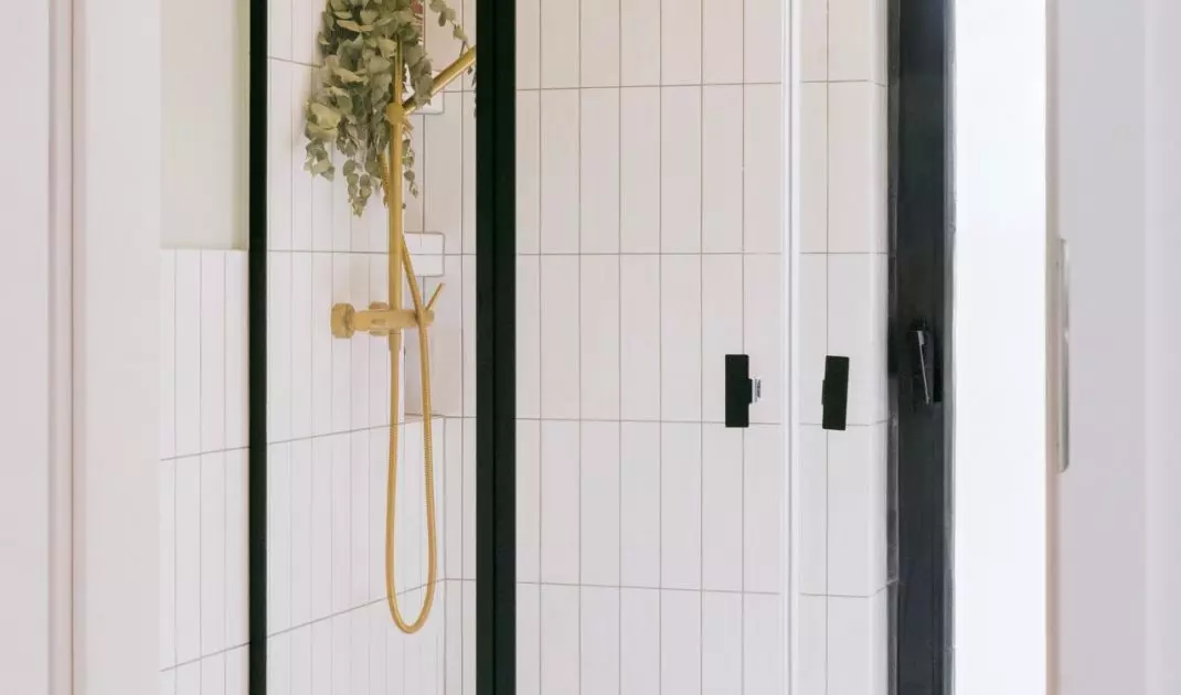 The bathroom floor is covered with ornate tiles
